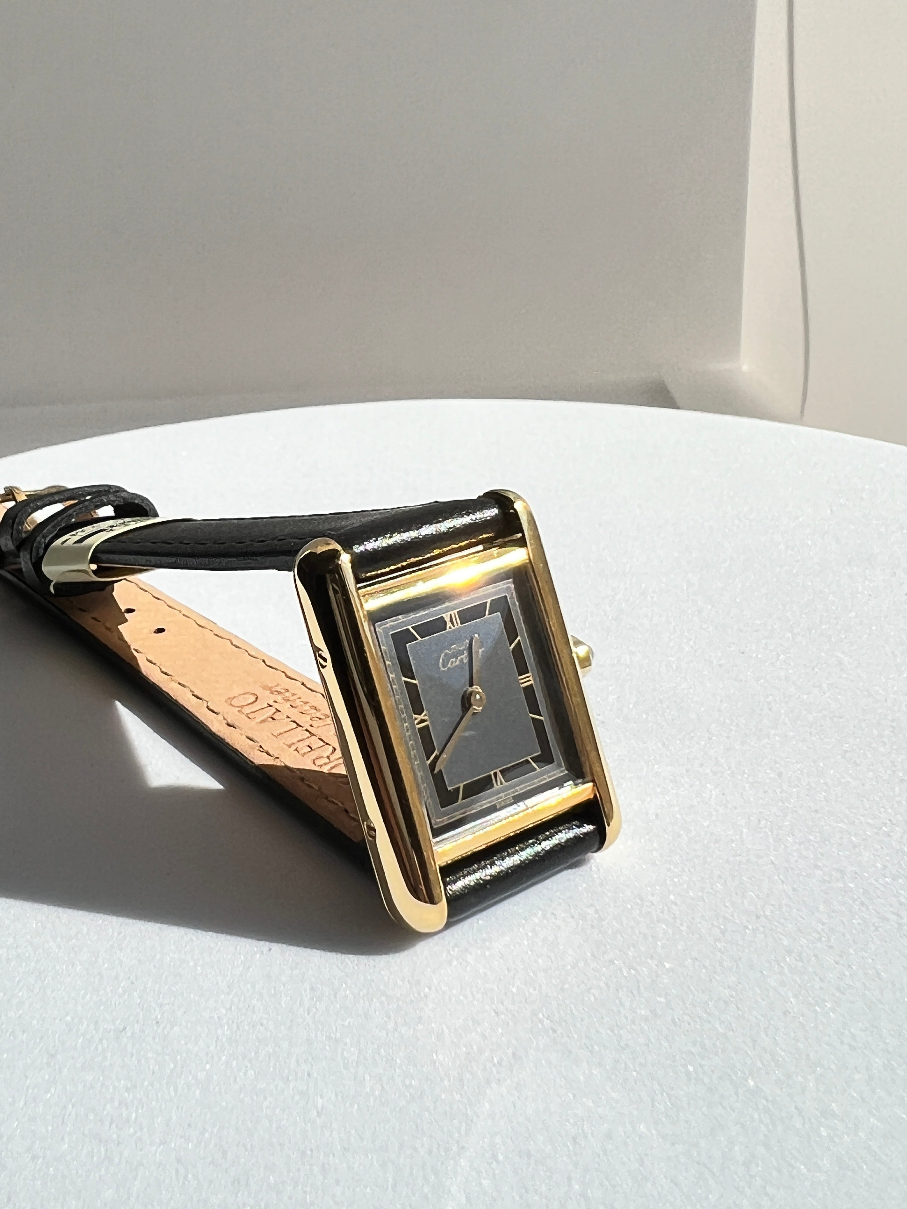 Must de Cartier Tank, black Roman dial, small and medium size, sterling silver with 18K vermeil